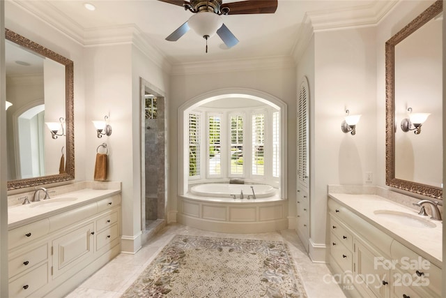 bathroom featuring vanity, separate shower and tub, ornamental molding, and ceiling fan