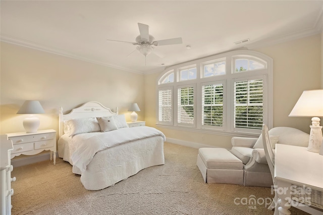 bedroom with crown molding, ceiling fan, and carpet