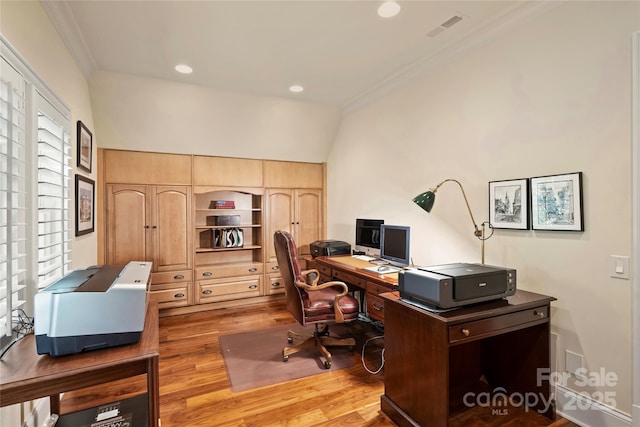 office area featuring lofted ceiling, crown molding, and light hardwood / wood-style floors