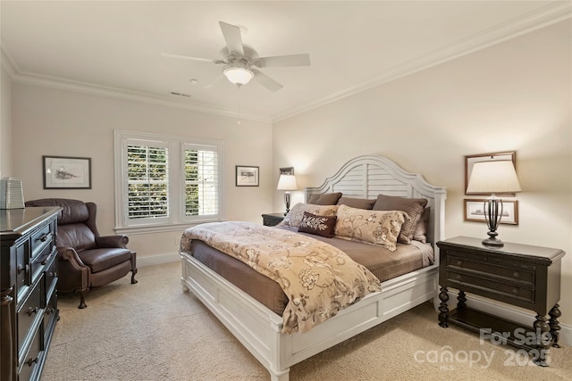 bedroom featuring ceiling fan, ornamental molding, and light colored carpet