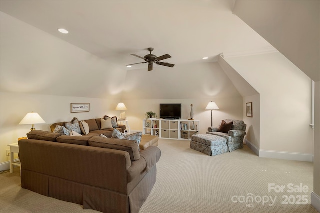 living room featuring vaulted ceiling, light carpet, and ceiling fan