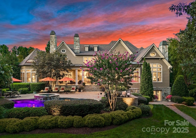 view of front of house with a patio