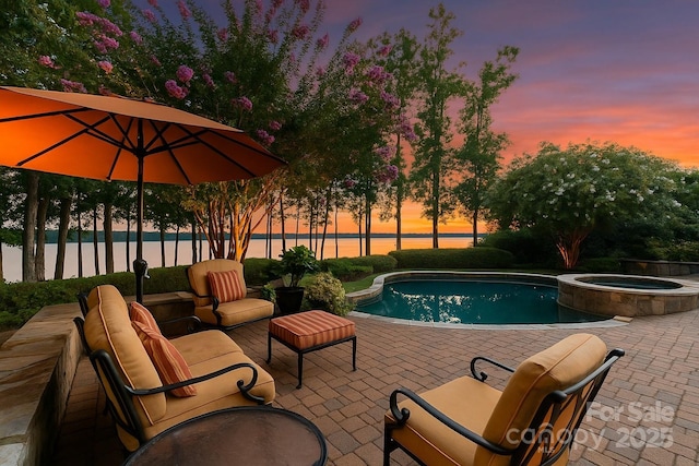 155 Union Chapel Dr, Mooresville, NC 28117 - view of pool featuring a patio area, a water view, a pool with connected hot tub, and an outdoor hangout area