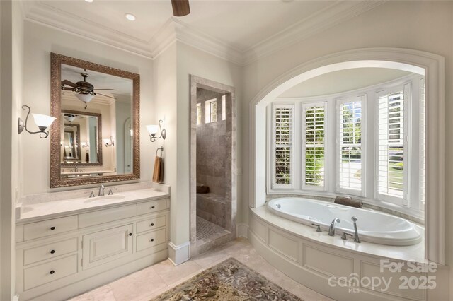 155 Union Chapel Dr, Mooresville, NC 28117 - bathroom featuring ceiling fan, a garden tub, plenty of natural light, vanity, and crown molding