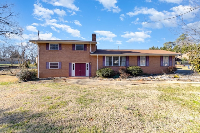 split level home featuring a front lawn