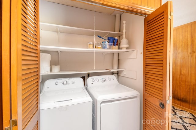 clothes washing area featuring independent washer and dryer