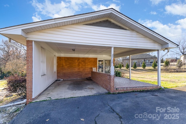 view of vehicle parking featuring a carport