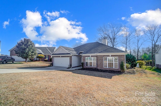 view of front facade featuring a garage and a front lawn