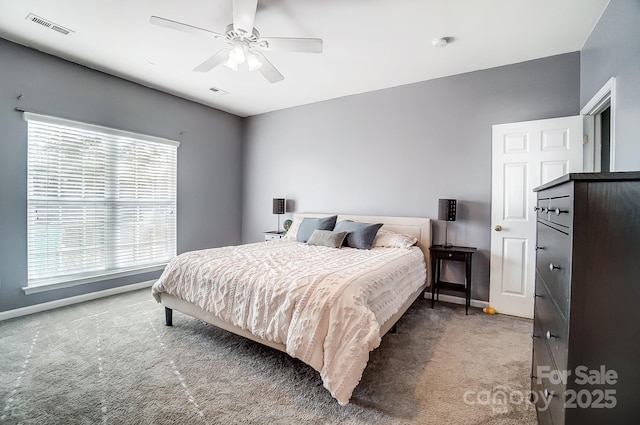 carpeted bedroom with ceiling fan