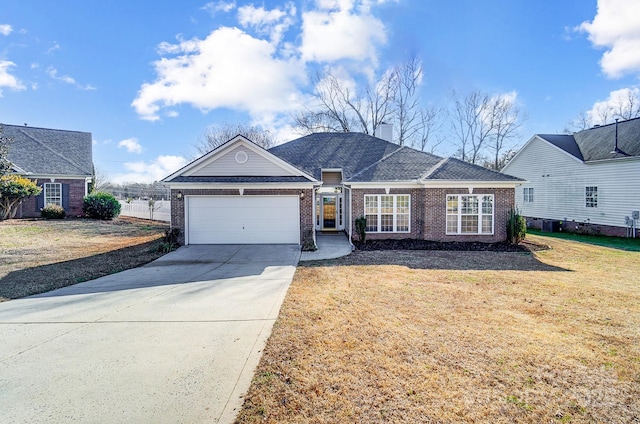 single story home with a garage and a front yard