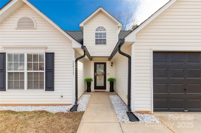 entrance to property featuring a garage