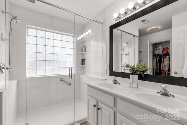 bathroom featuring vanity and walk in shower