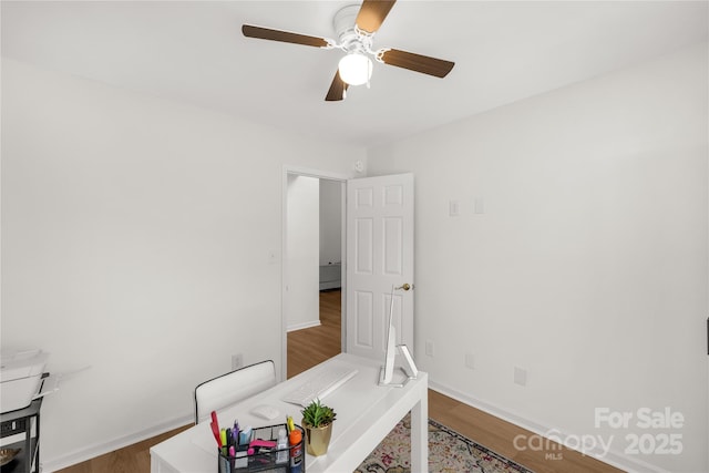 office area featuring wood-type flooring and ceiling fan