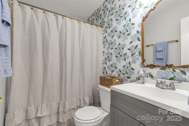 bathroom with vanity and toilet