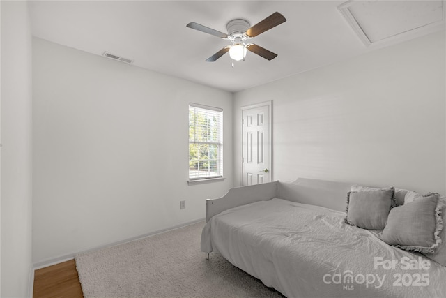 bedroom with wood-type flooring and ceiling fan