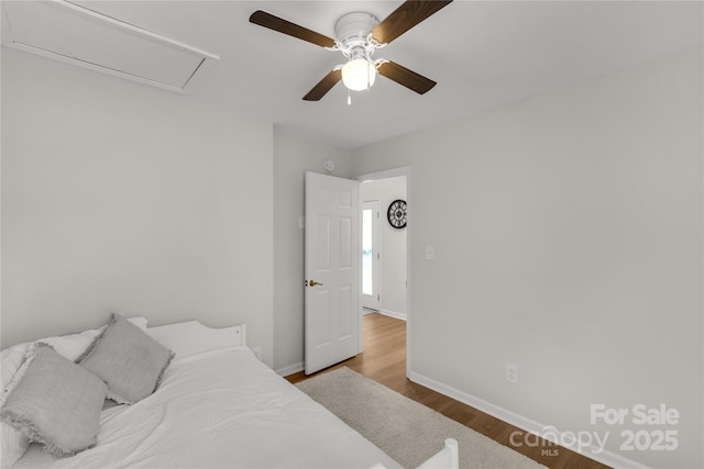 bedroom with hardwood / wood-style flooring and ceiling fan