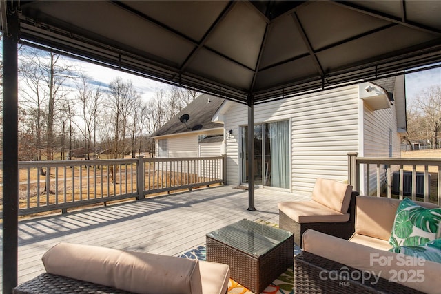 wooden terrace featuring an outdoor hangout area and central air condition unit