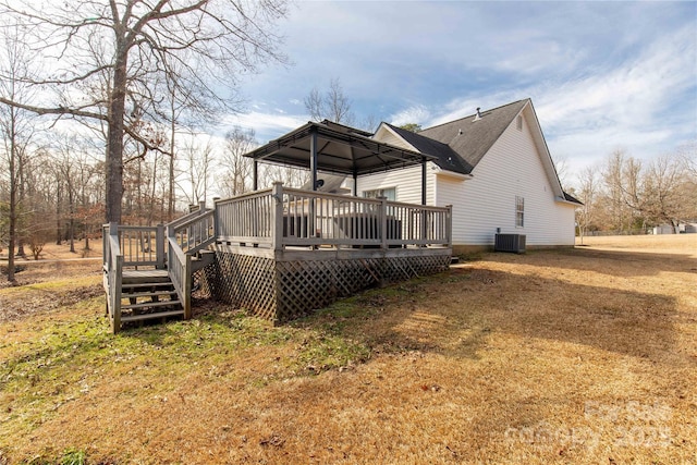 back of house with central AC unit, a gazebo, a yard, and a deck