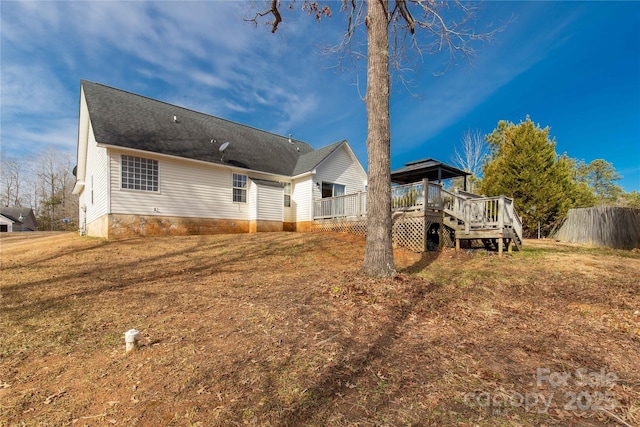 exterior space with a lawn and a deck