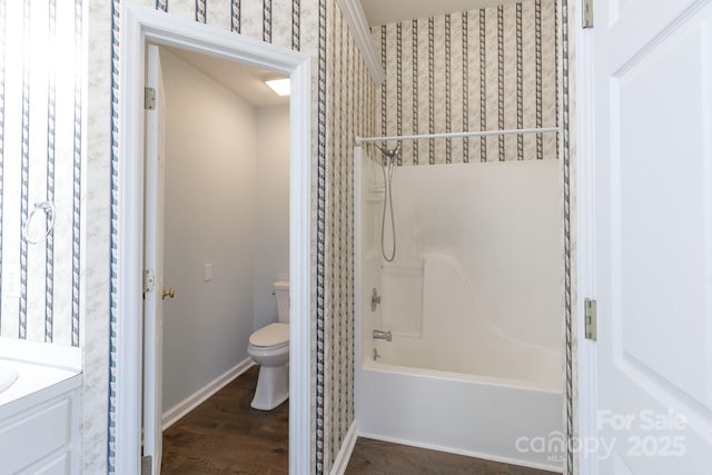 full bathroom with vanity, hardwood / wood-style flooring, shower / bathtub combination, and toilet