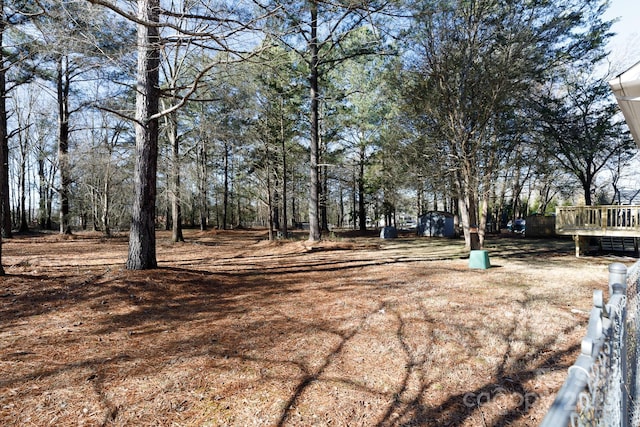 view of yard with a wooden deck