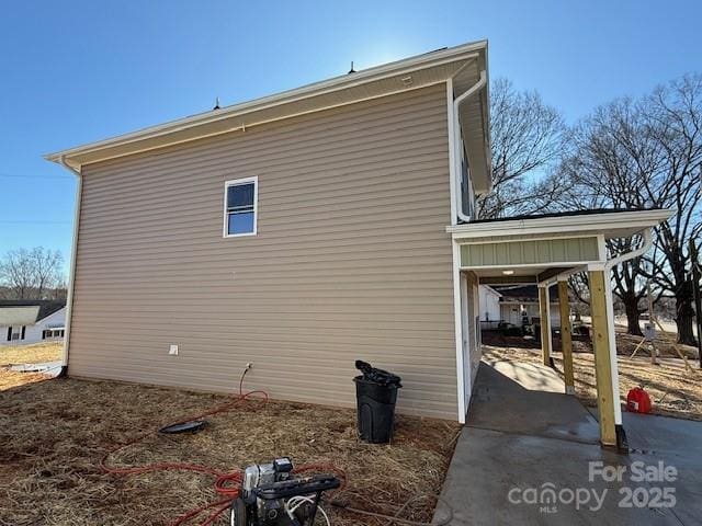 view of property exterior featuring a carport