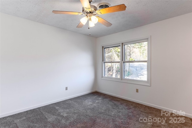 spare room with ceiling fan, carpet, and a textured ceiling