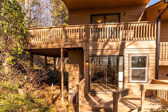 rear view of house with a wooden deck