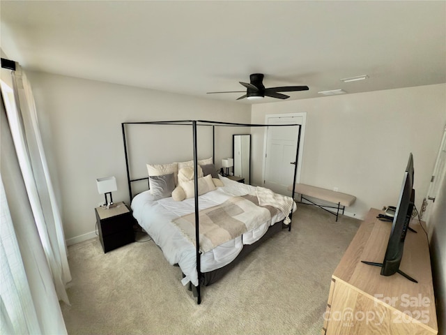 bedroom with ceiling fan and light carpet