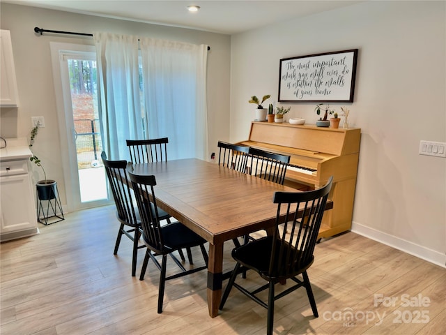 dining space featuring light hardwood / wood-style flooring