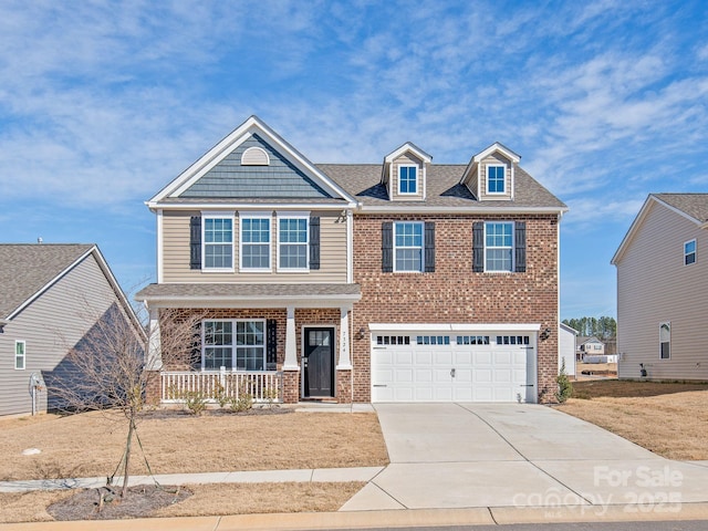 view of front facade with a garage and a porch