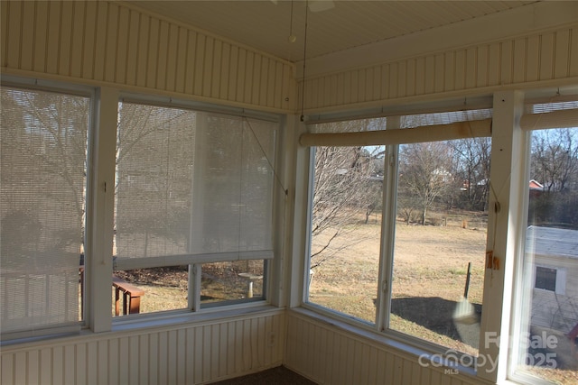 unfurnished sunroom featuring a healthy amount of sunlight