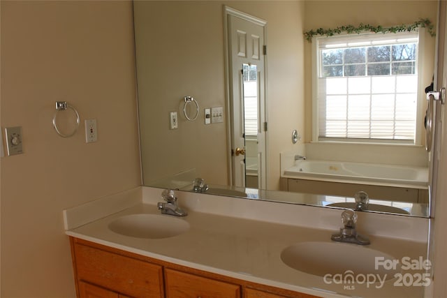 bathroom with vanity and a bath