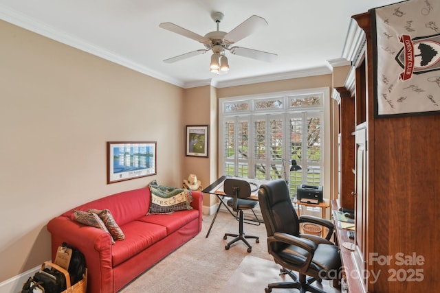 home office featuring ceiling fan, ornamental molding, and light carpet