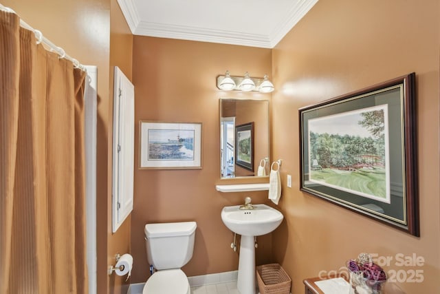 bathroom featuring walk in shower, ornamental molding, and toilet