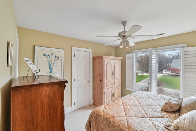 carpeted bedroom with ceiling fan