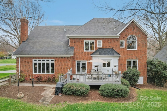 back of property featuring a patio and a deck