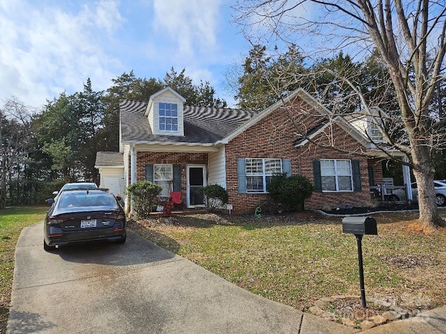 view of front of home featuring a garage and a front yard