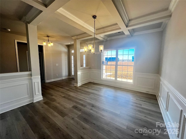 unfurnished dining area with an inviting chandelier, dark wood-style floors, and beam ceiling