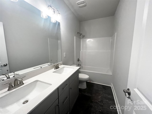 bathroom featuring toilet, double vanity, visible vents, and a sink