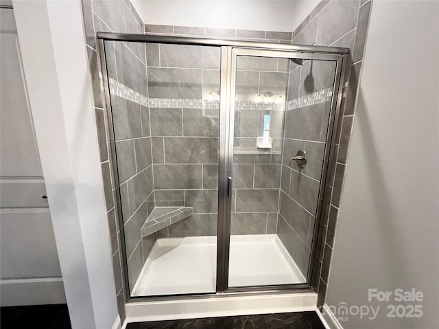 bathroom featuring a shower stall