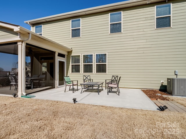 rear view of property featuring a patio and central AC unit