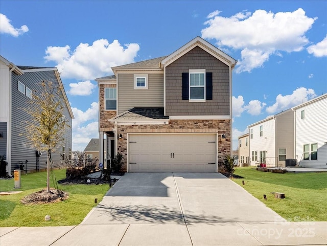 view of front of property featuring a garage and a front yard