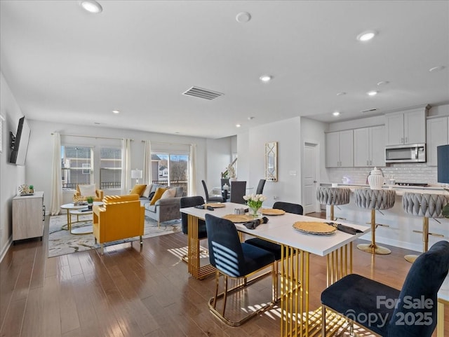 dining area with dark wood-type flooring