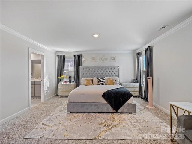 carpeted bedroom featuring ornamental molding and ensuite bathroom