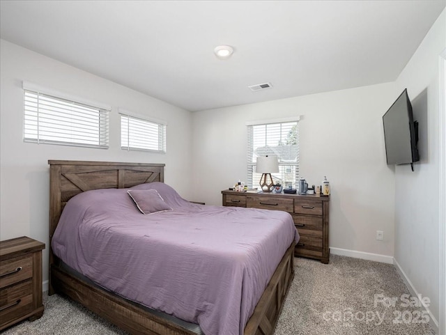 bedroom with light carpet