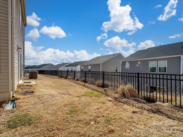 view of yard featuring central air condition unit