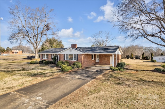 ranch-style home with a front yard