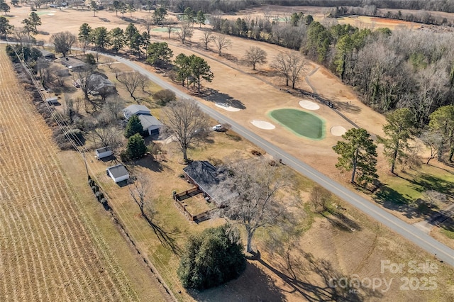 birds eye view of property with a rural view