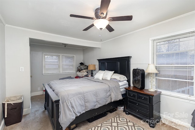 bedroom with crown molding, light colored carpet, and ceiling fan